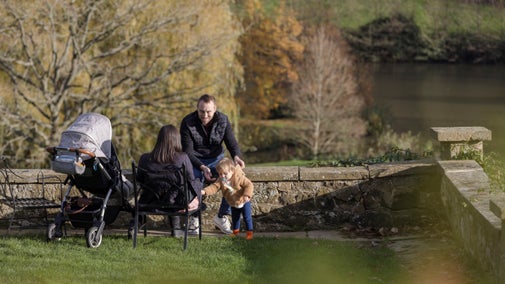 Family sitting in the garden at Chartwell in Winter